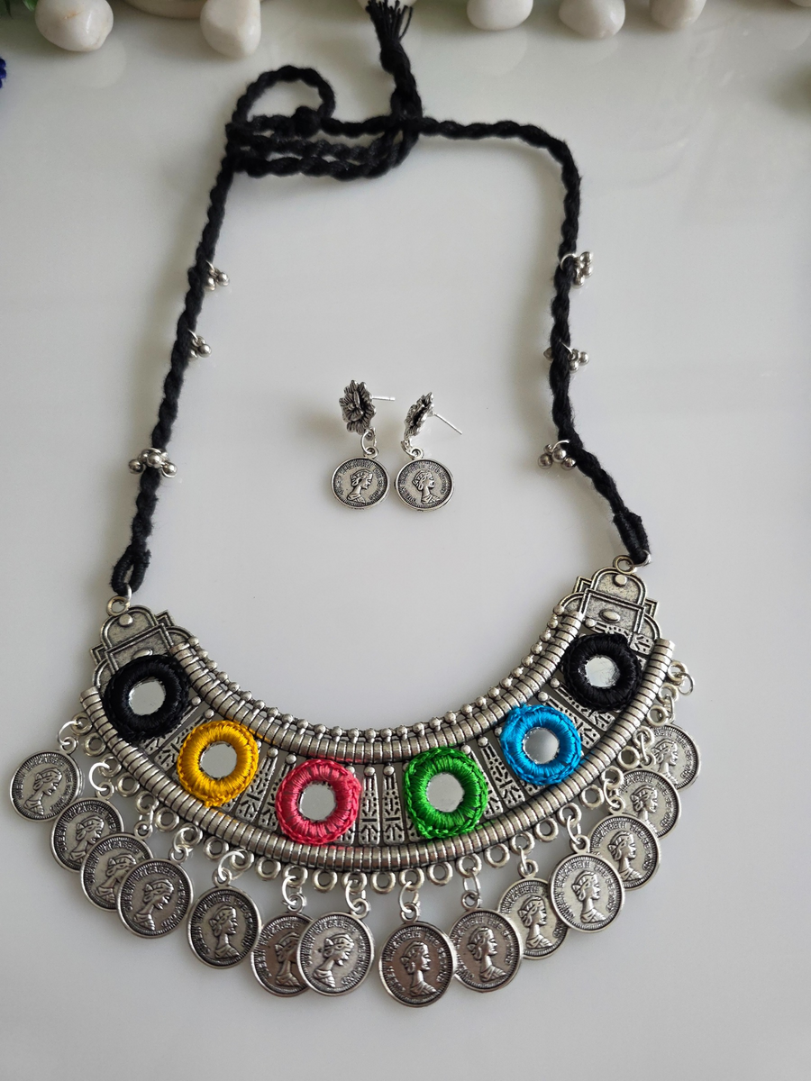 Silver hasli with ginny charms